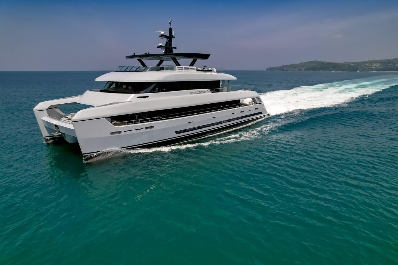 a white yacht in the water aboard SPACECAT Yacht for Sale