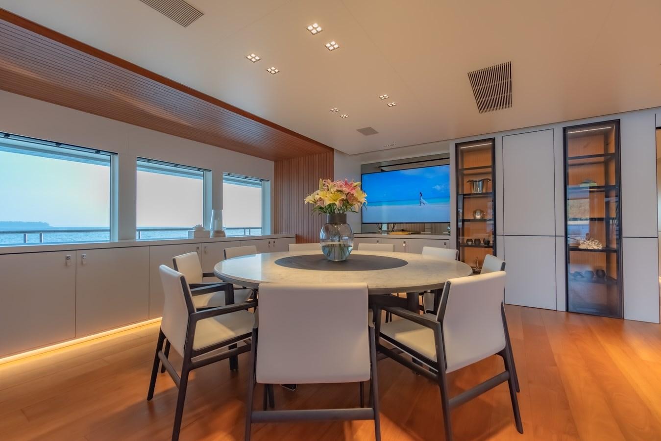 a large kitchen with a table and chairs aboard SPACECAT Yacht for Sale