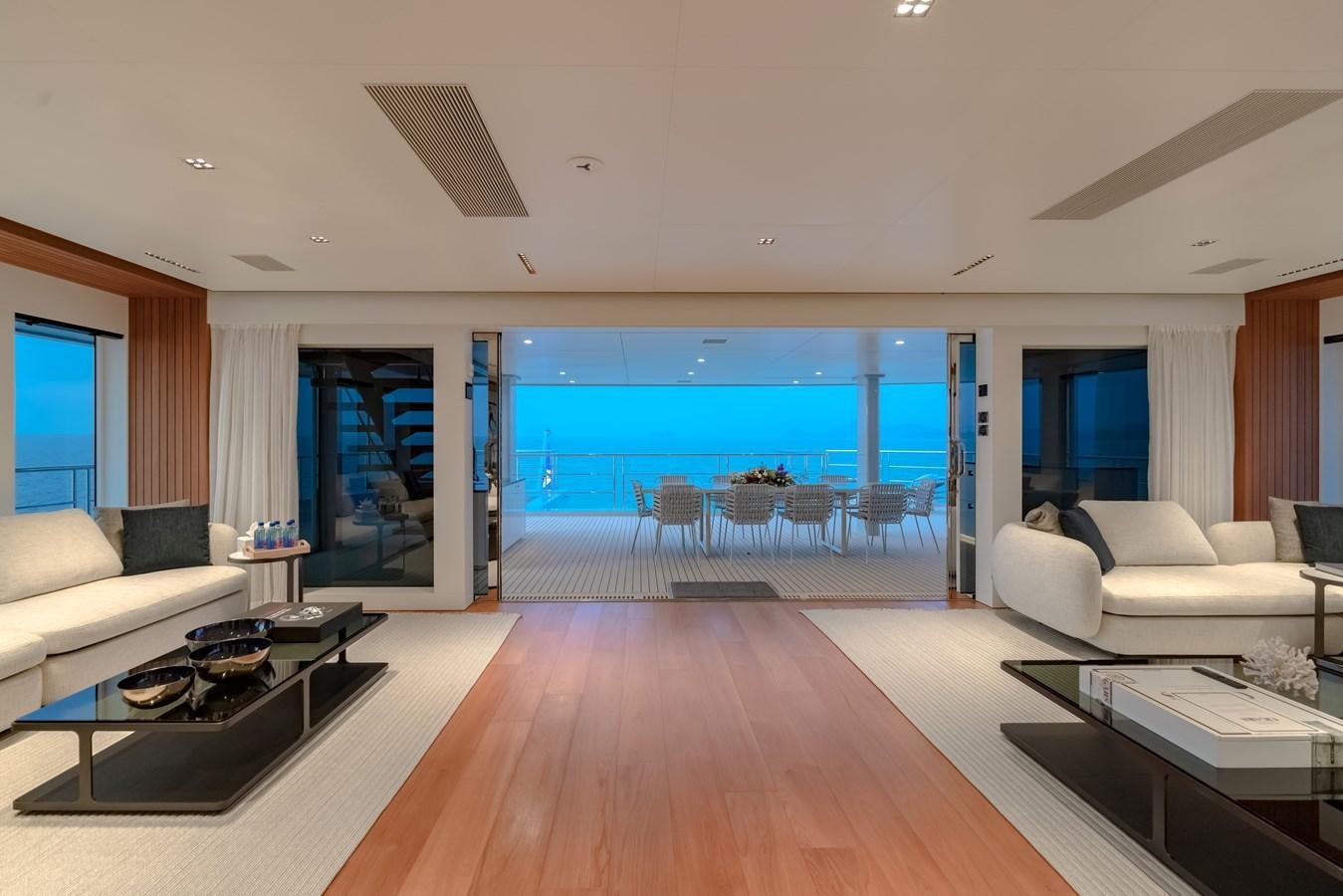 a living room with a large pool aboard SPACECAT Yacht for Sale