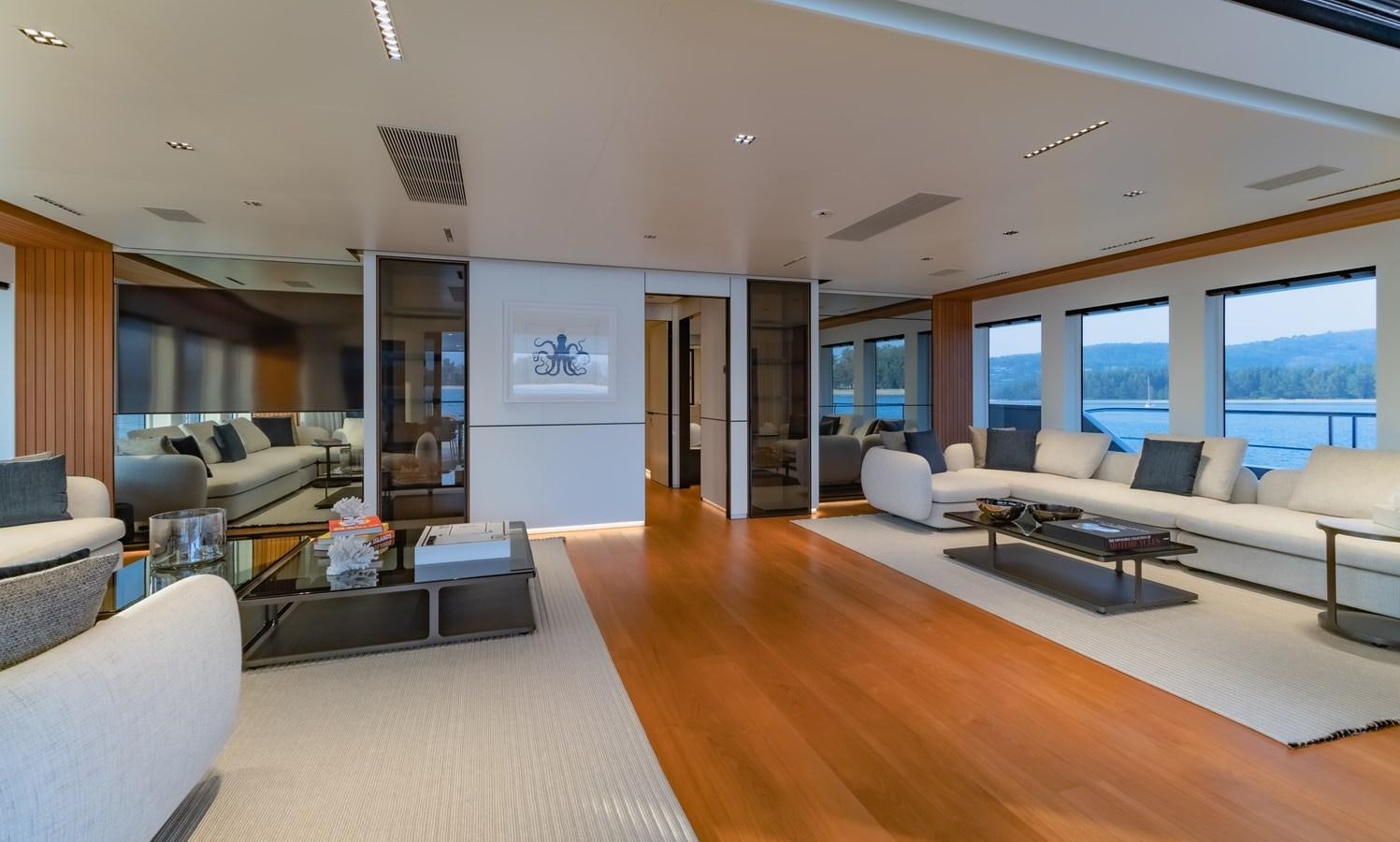 a living room with a large window aboard SPACECAT Yacht for Sale