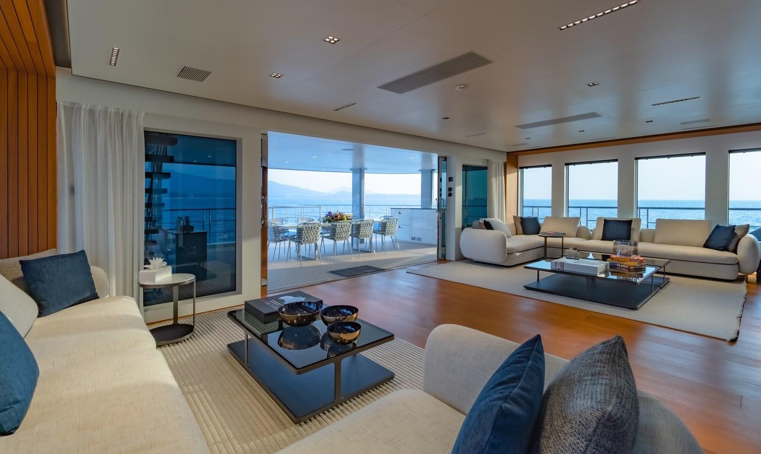 a living room with a large window aboard SPACECAT Yacht for Sale