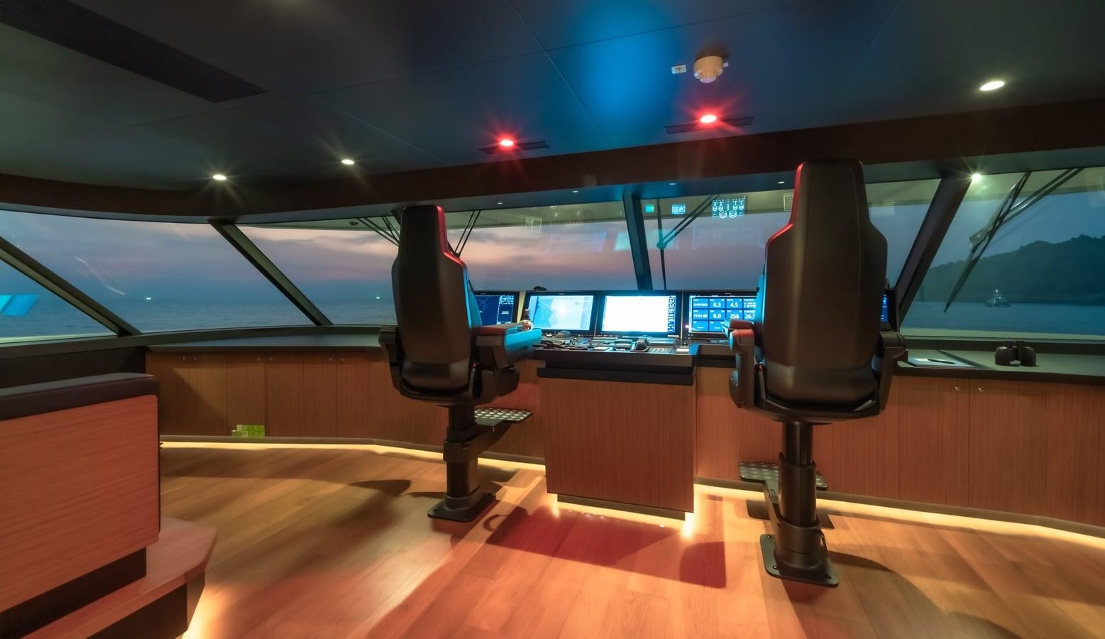 a room with a tv and a chair aboard SPACECAT Yacht for Sale