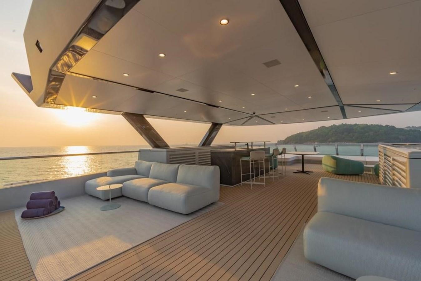 a large living room with a large pool aboard SPACECAT Yacht for Sale