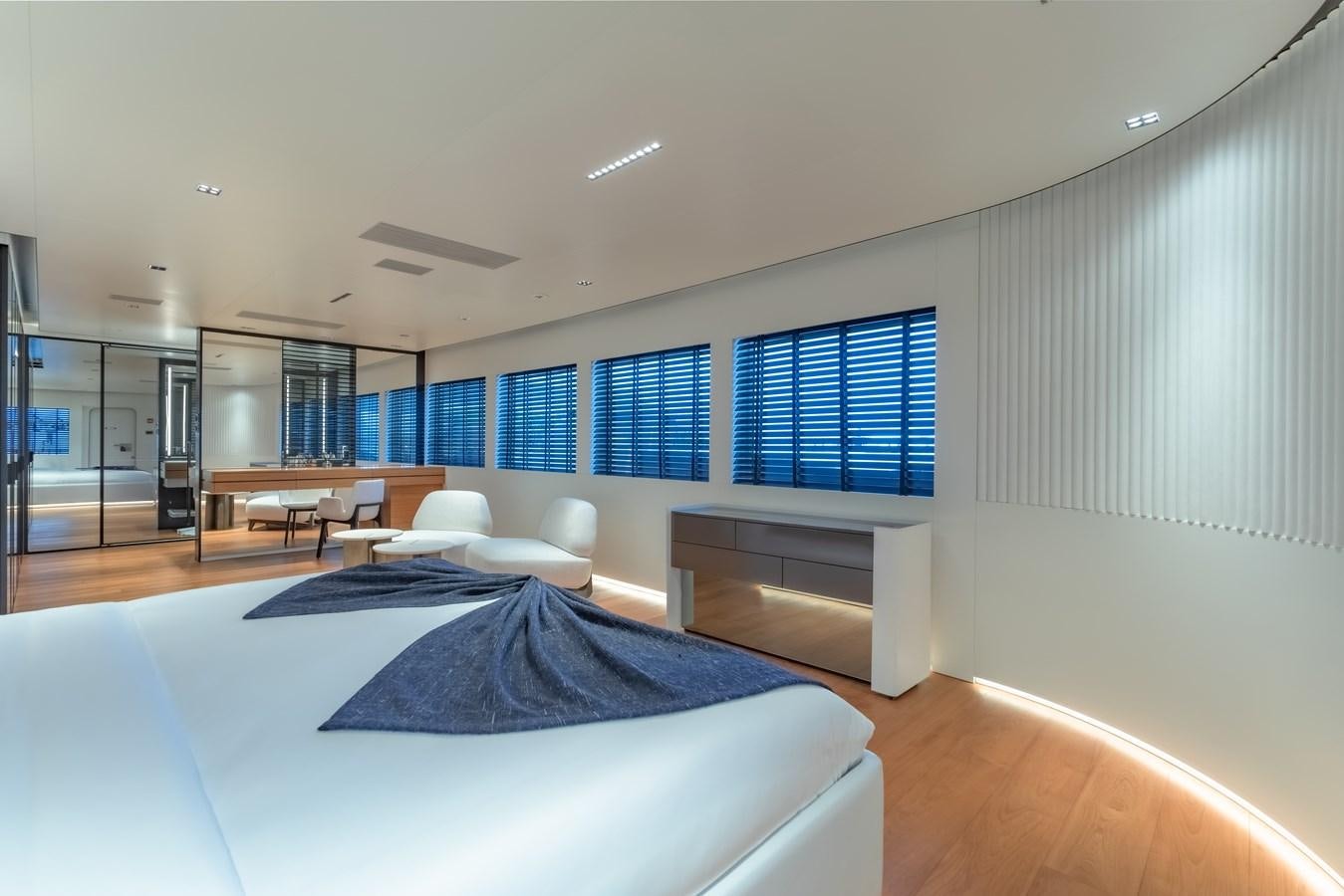 a room with a bed and a desk aboard SPACECAT Yacht for Sale