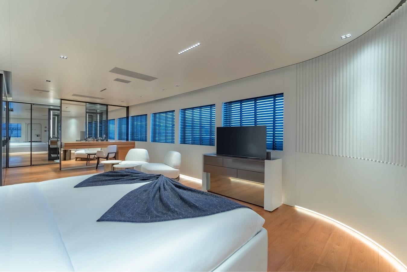 a room with a bed and a tv aboard SPACECAT Yacht for Sale