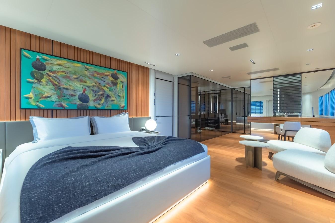 a large bedroom with a large bed aboard SPACECAT Yacht for Sale