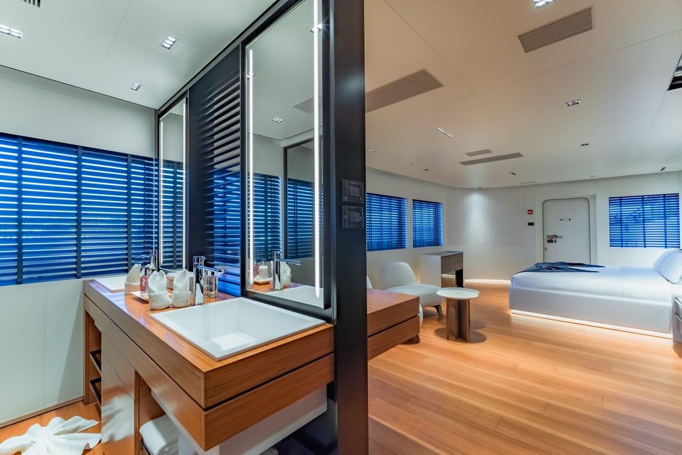 a bathroom with a large mirror aboard SPACECAT Yacht for Sale