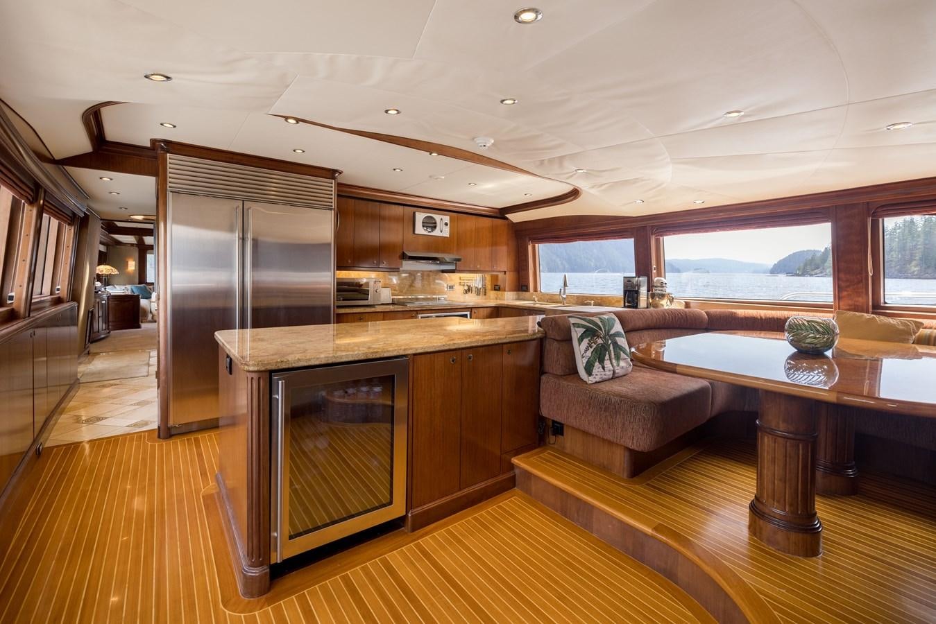 a large kitchen with a large island aboard REPOSADO Yacht for Sale
