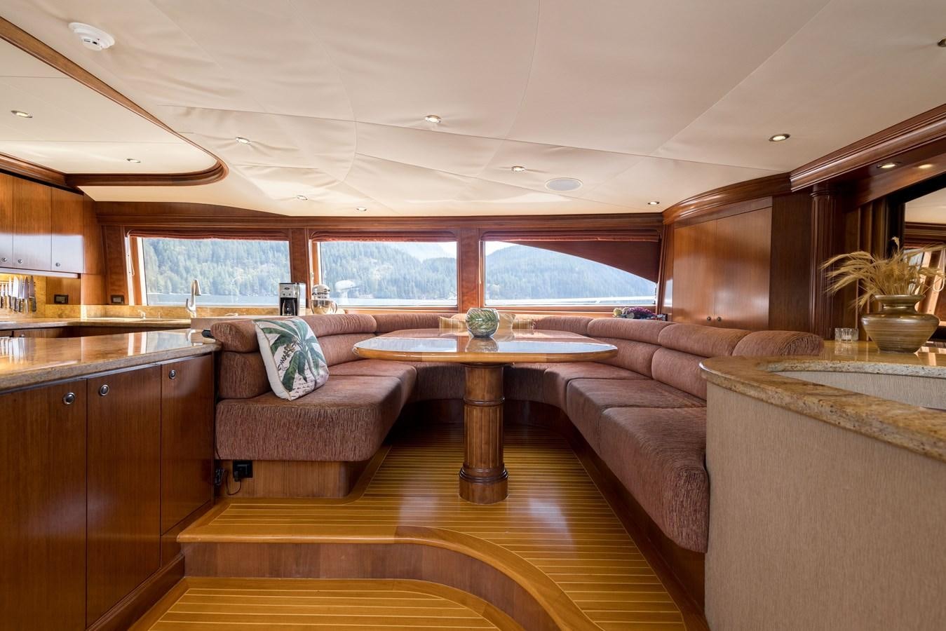 a living room with a couch and a table aboard REPOSADO Yacht for Sale