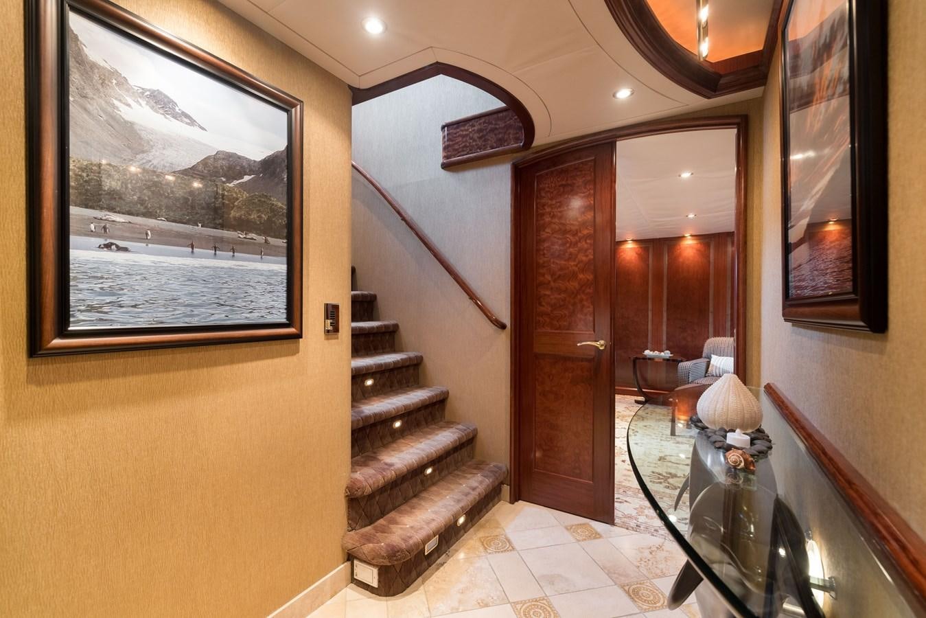a room with a wood door and a window aboard REPOSADO Yacht for Sale