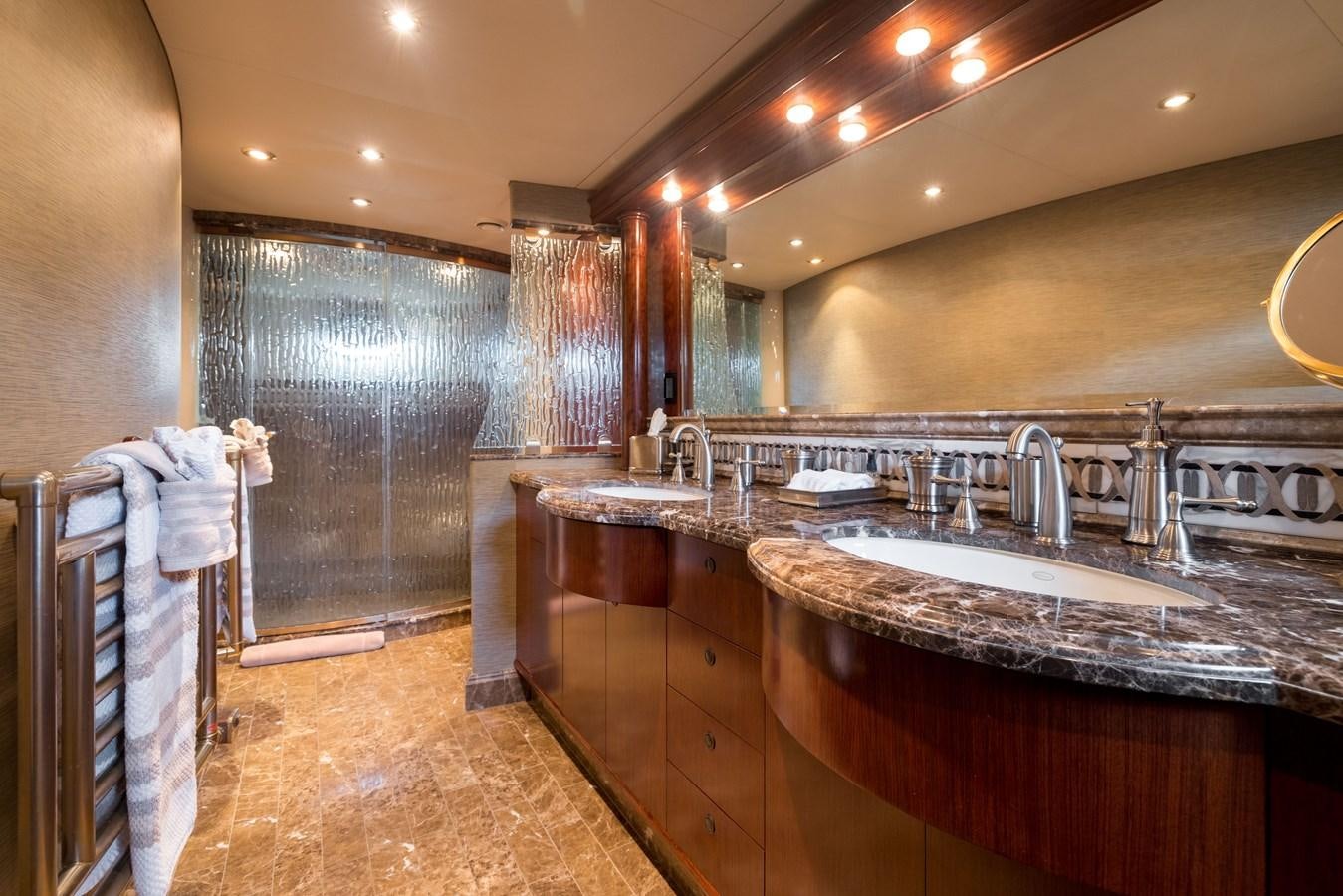 a bathroom with a countertop sink and a large mirror aboard REPOSADO Yacht for Sale
