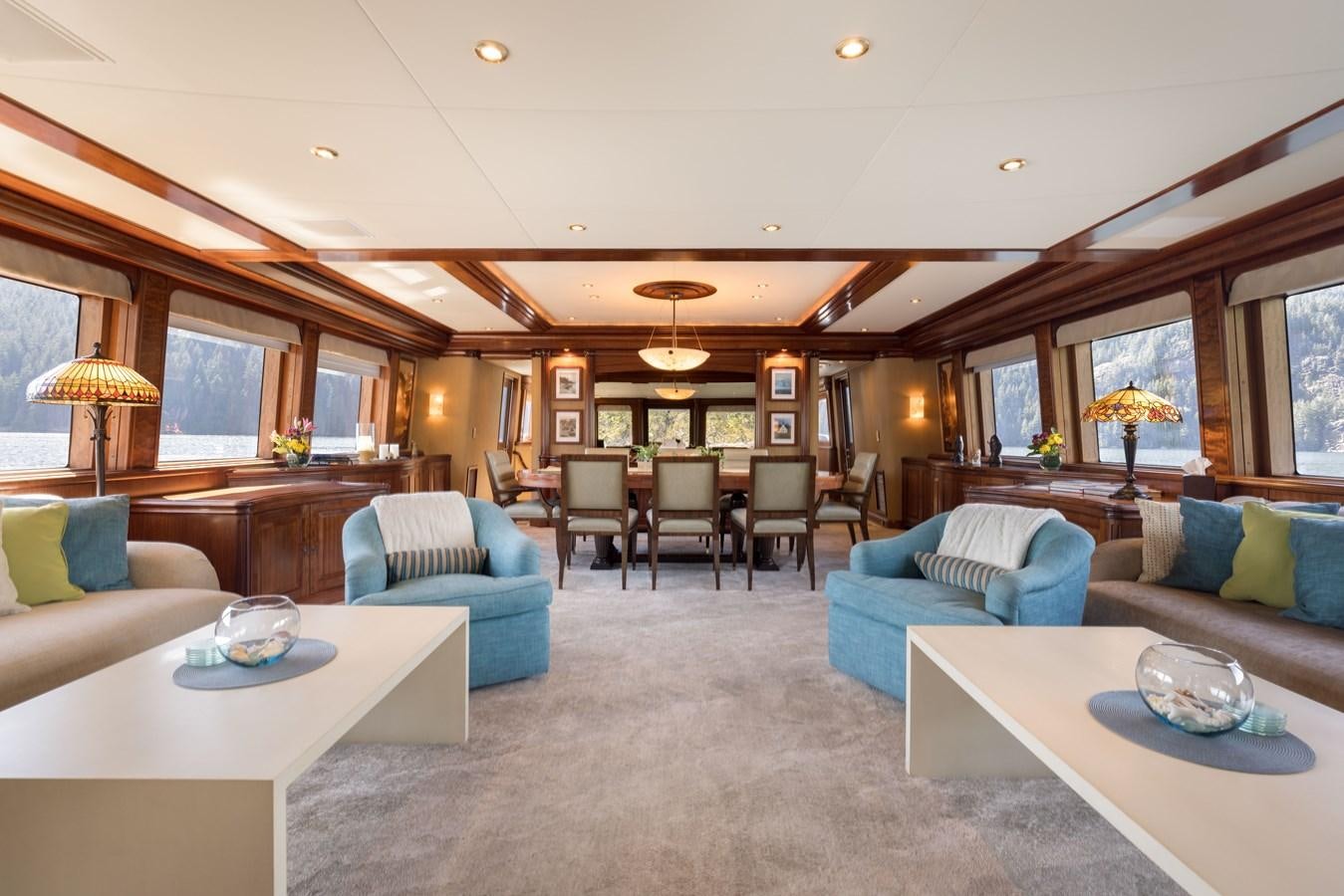 a living room with a couch and a table aboard REPOSADO Yacht for Sale