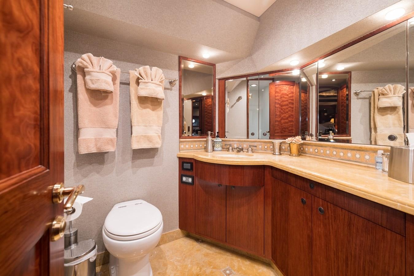 a bathroom with a large mirror aboard REPOSADO Yacht for Sale