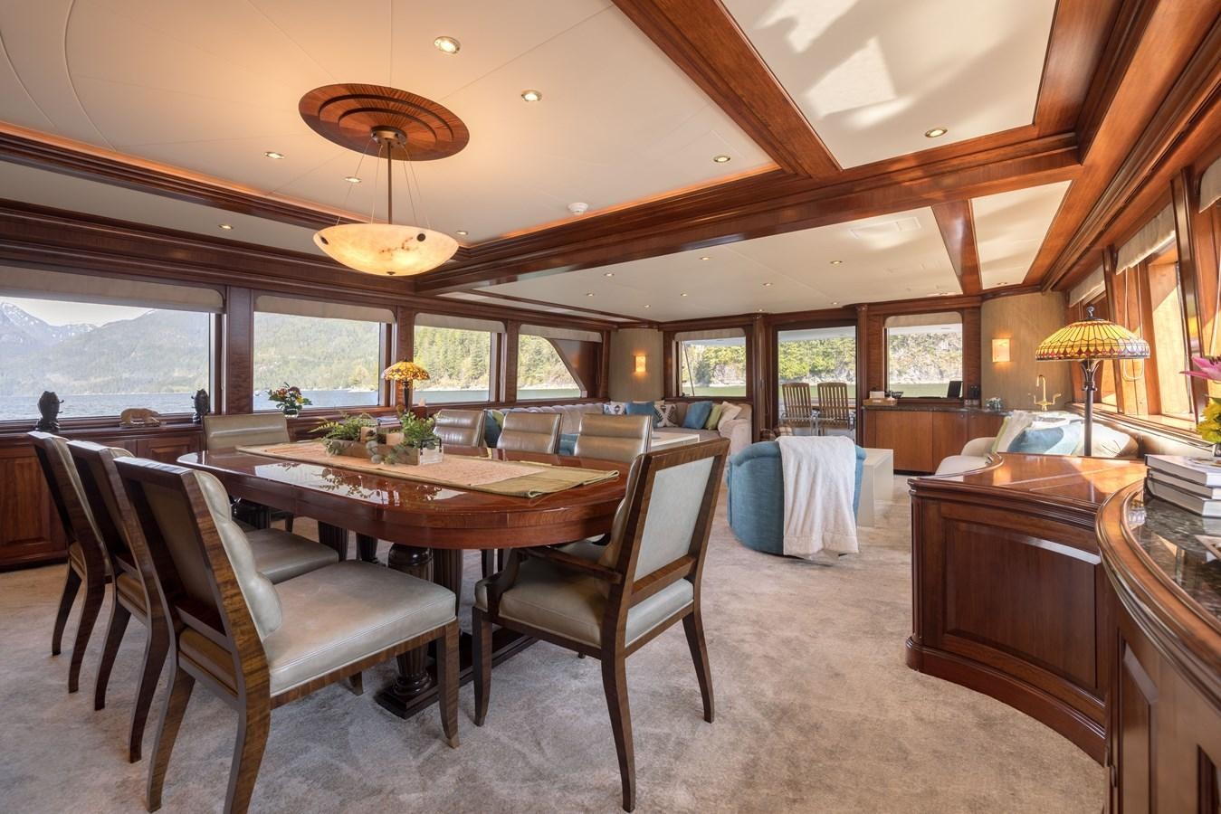 a large dining room with a large table and chairs aboard REPOSADO Yacht for Sale