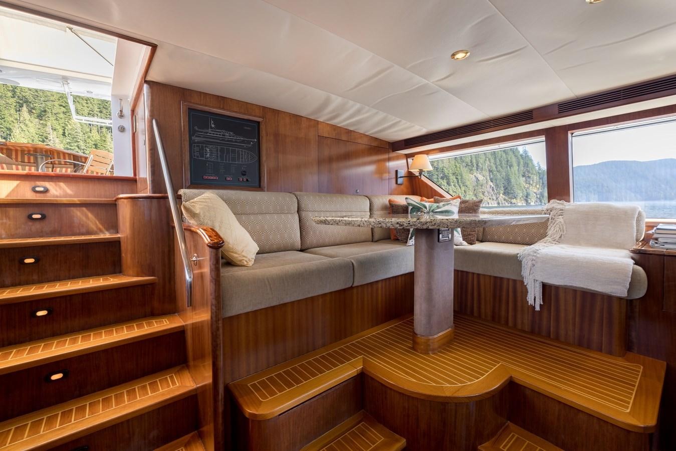 a room with a couch and a table aboard REPOSADO Yacht for Sale