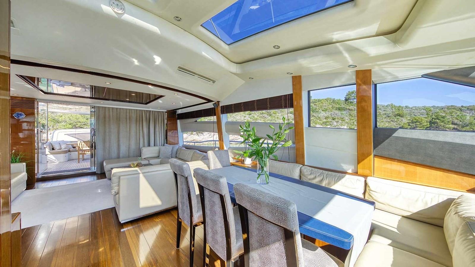 a living room with a large open window aboard AGAVE Yacht for Sale