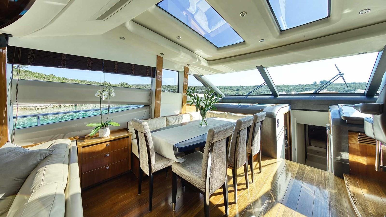 a room with a table and chairs aboard AGAVE Yacht for Sale