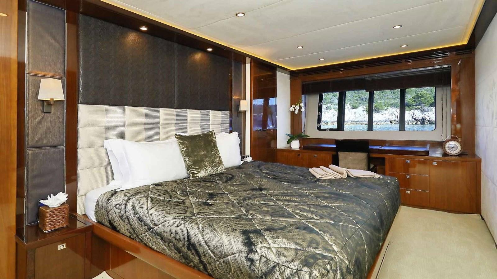a bed with white sheets aboard AGAVE Yacht for Sale