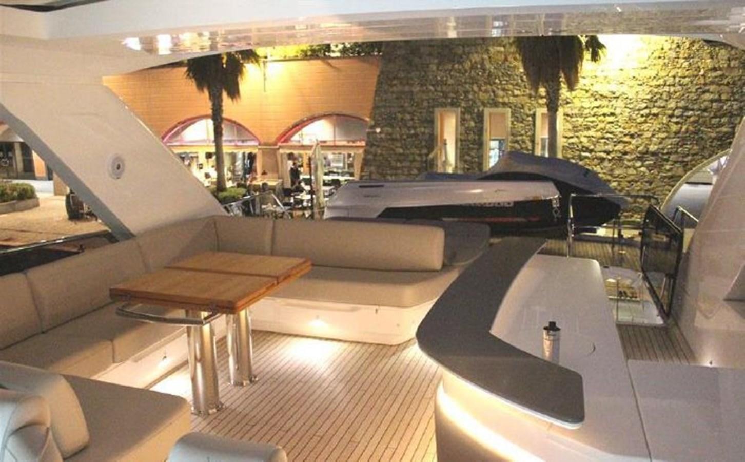 a room with a table and chairs aboard XM Yacht for Sale