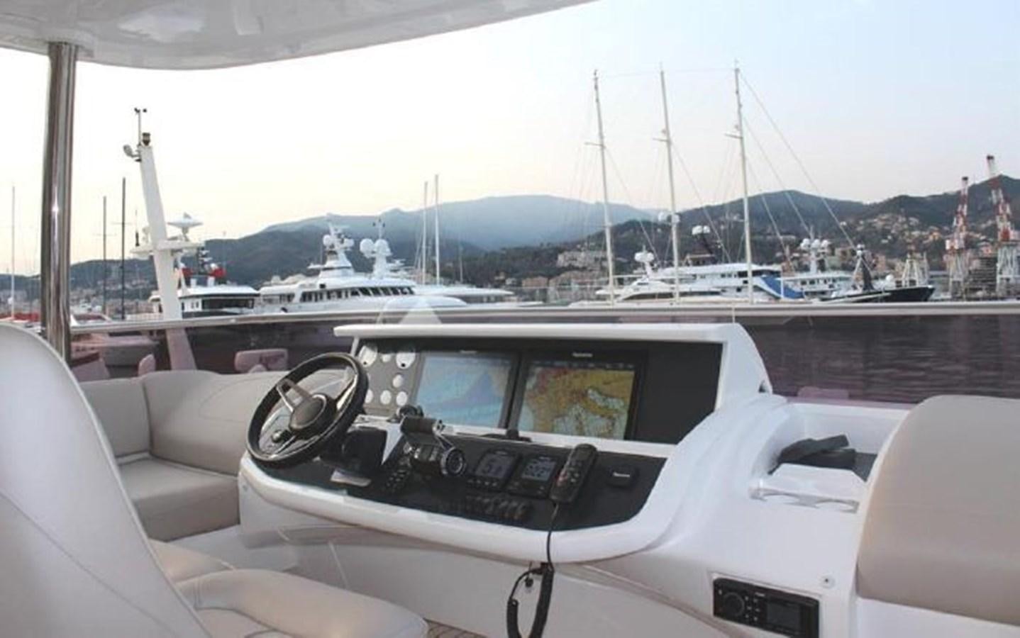a boat with a steering wheel aboard XM Yacht for Sale