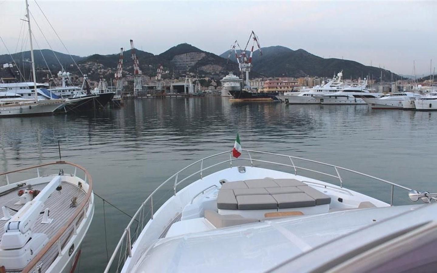 a group of boats in a harbor aboard XM Yacht for Sale