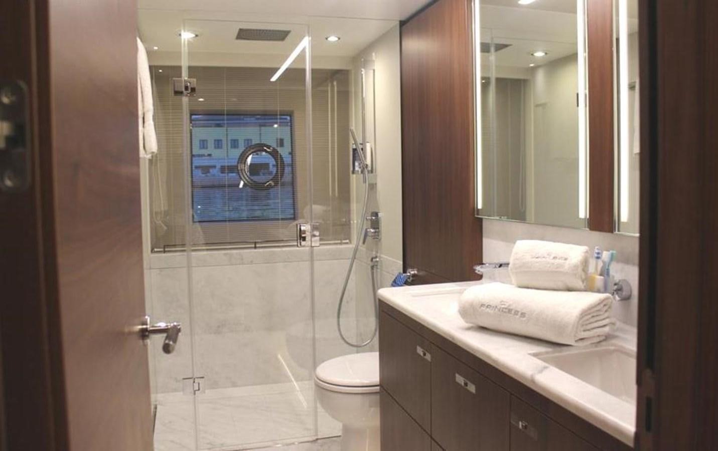 a bathroom with a shower and a sink aboard XM Yacht for Sale