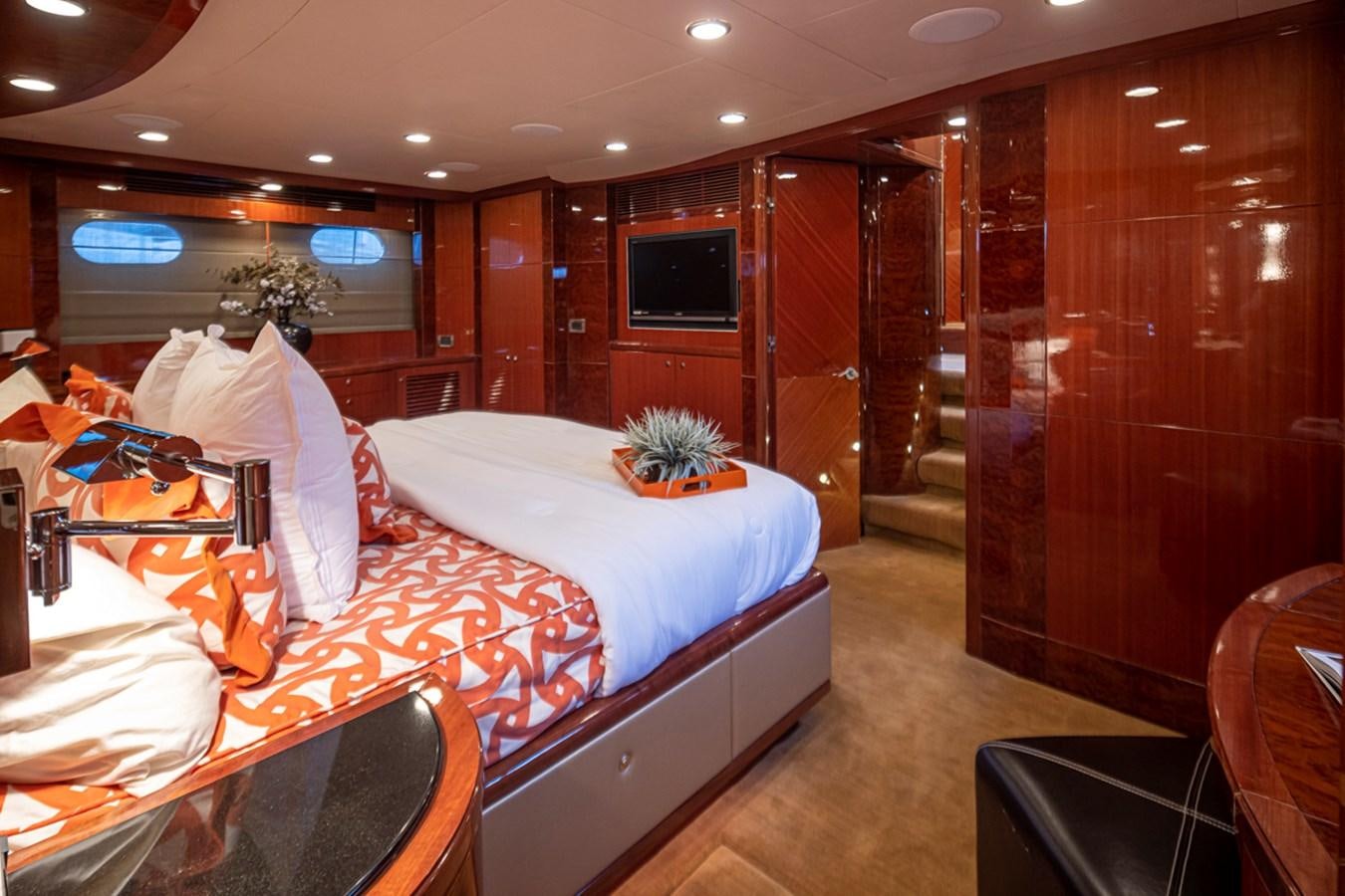 a room with a bed and a television aboard COCONUT Yacht for Sale