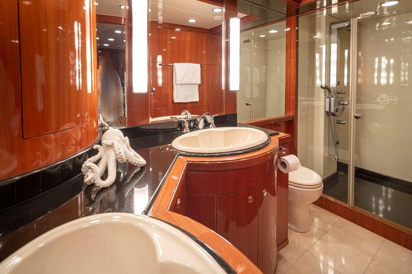 a bathroom with a bathtub and toilet aboard COCONUT Yacht for Sale