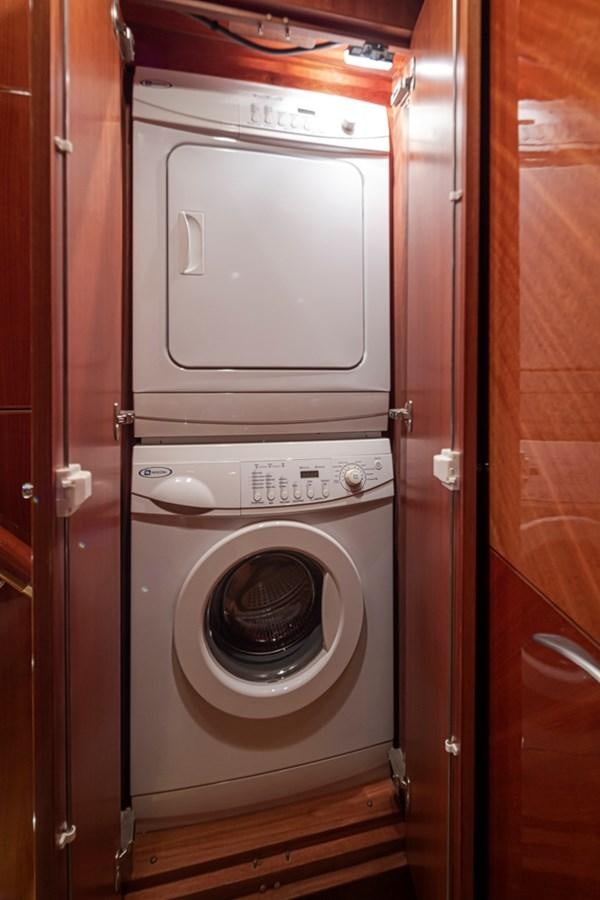 a white washing machine aboard COCONUT Yacht for Sale