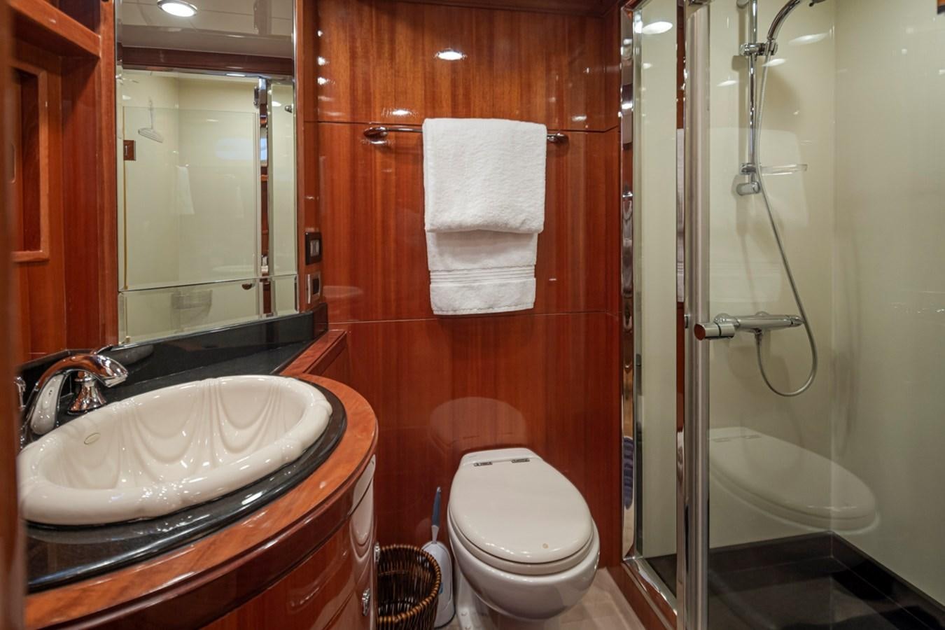 a bathroom with a sink and toilet aboard COCONUT Yacht for Sale
