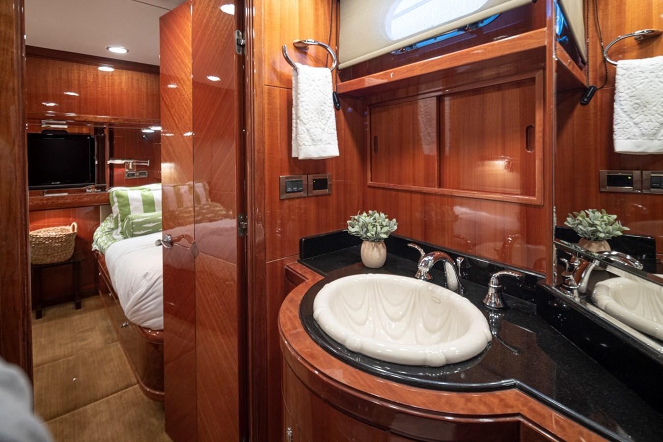 a bathroom with a sink and a mirror aboard COCONUT Yacht for Sale