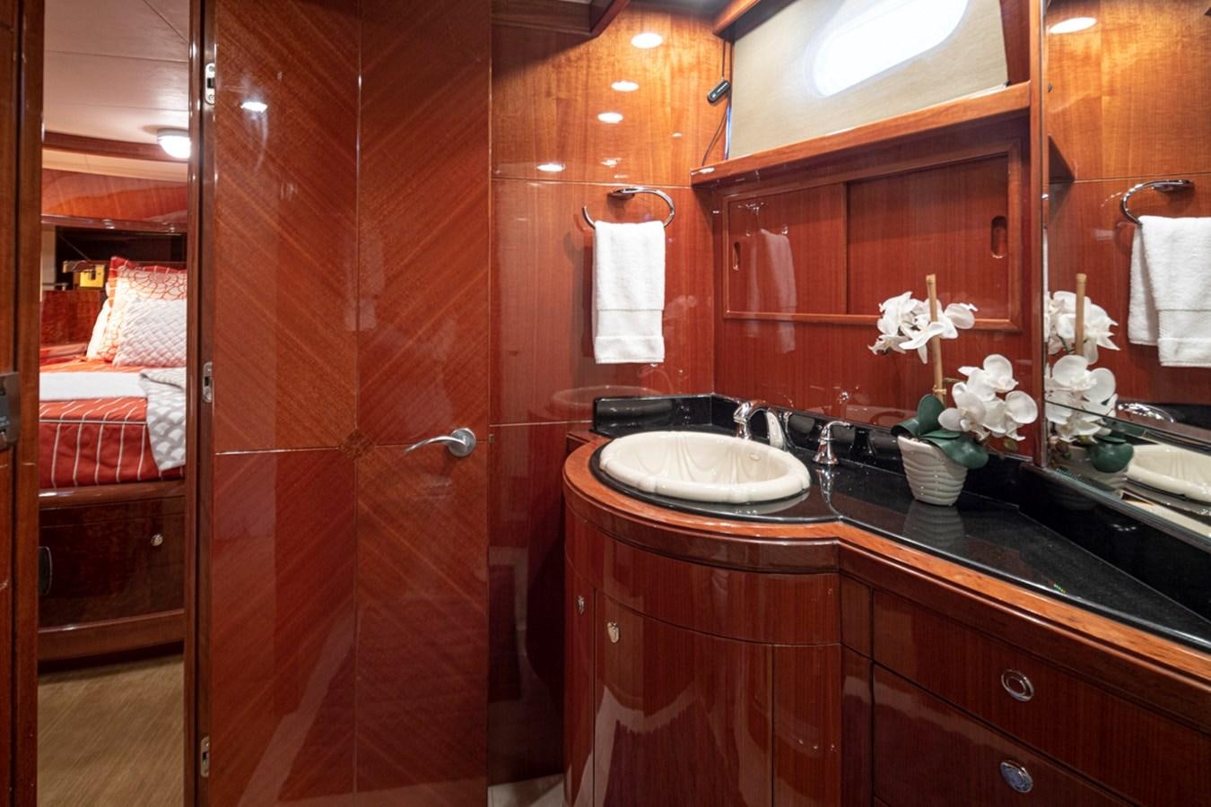 a bathroom with a sink and a mirror aboard COCONUT Yacht for Sale