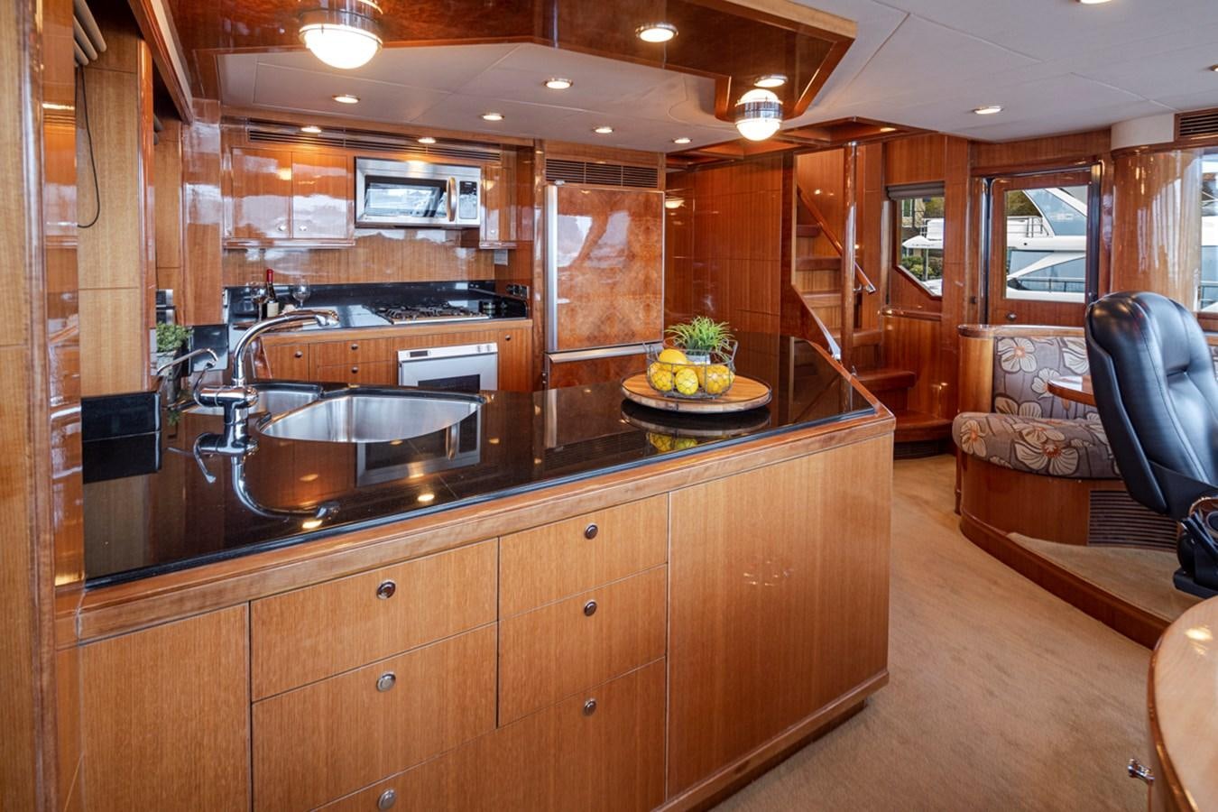 a kitchen with a large island aboard COCONUT Yacht for Sale