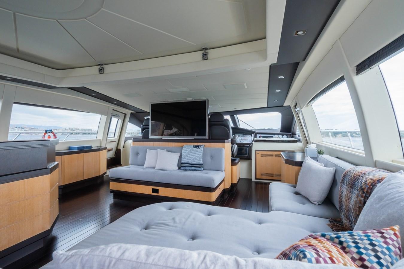 a living room with a bed and a television aboard TECHNOMARINE Yacht for Sale