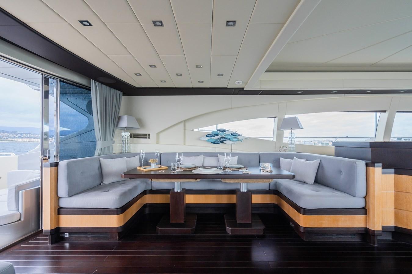 a living room with a large window aboard TECHNOMARINE Yacht for Sale