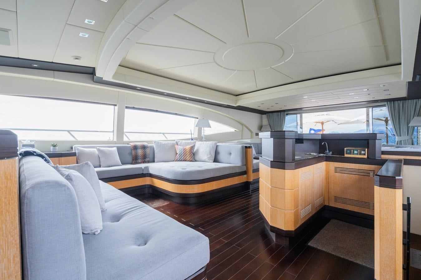 a room with a couch and a desk aboard TECHNOMARINE Yacht for Sale