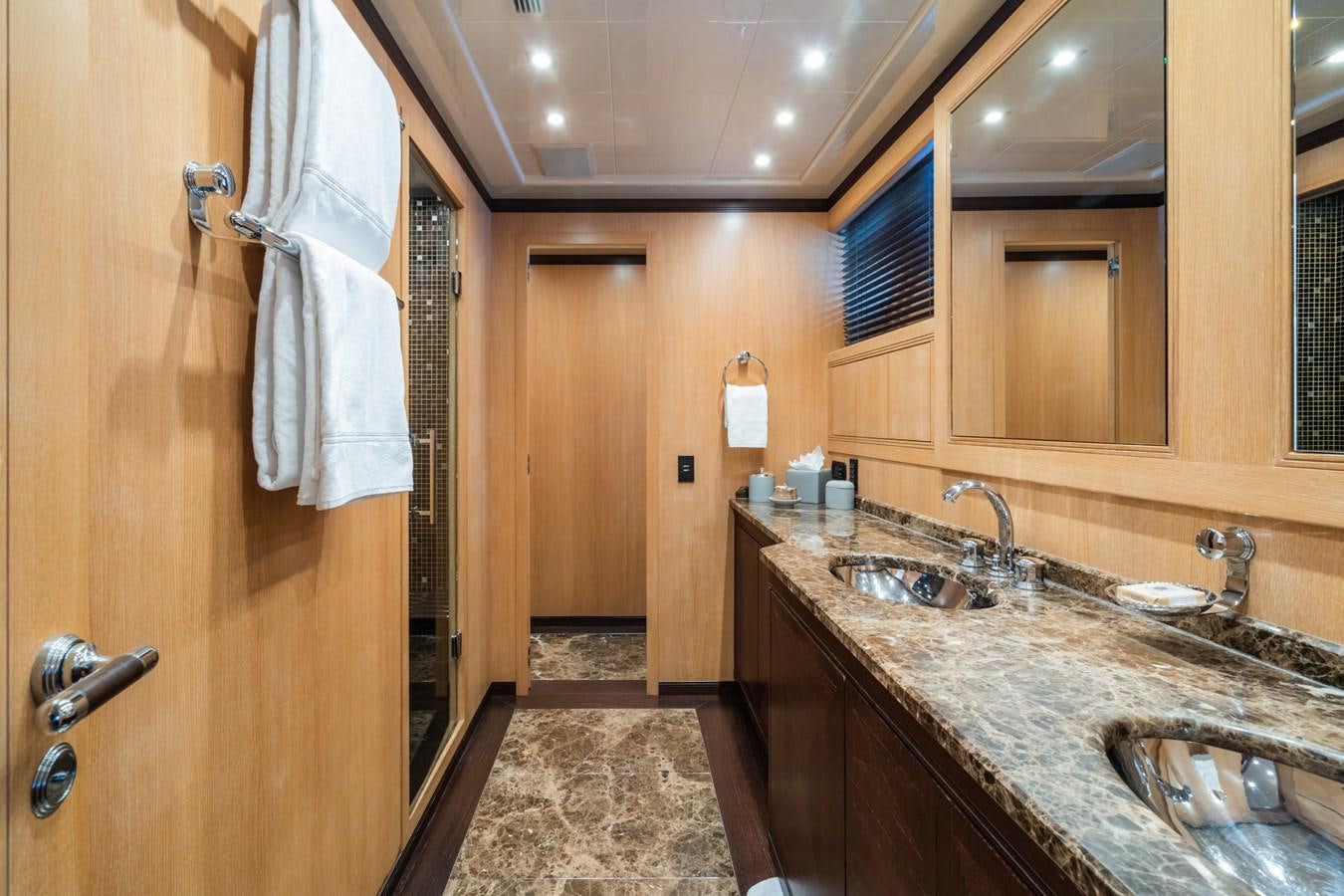 a bathroom with a sink and a mirror aboard TECHNOMARINE Yacht for Sale