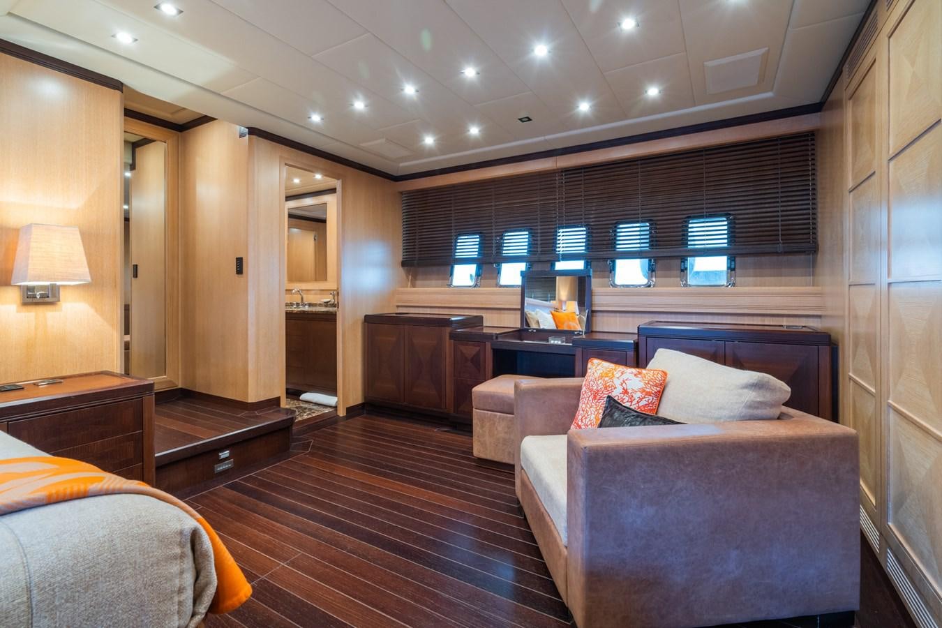 a large living room with a wood floor aboard TECHNOMARINE Yacht for Sale
