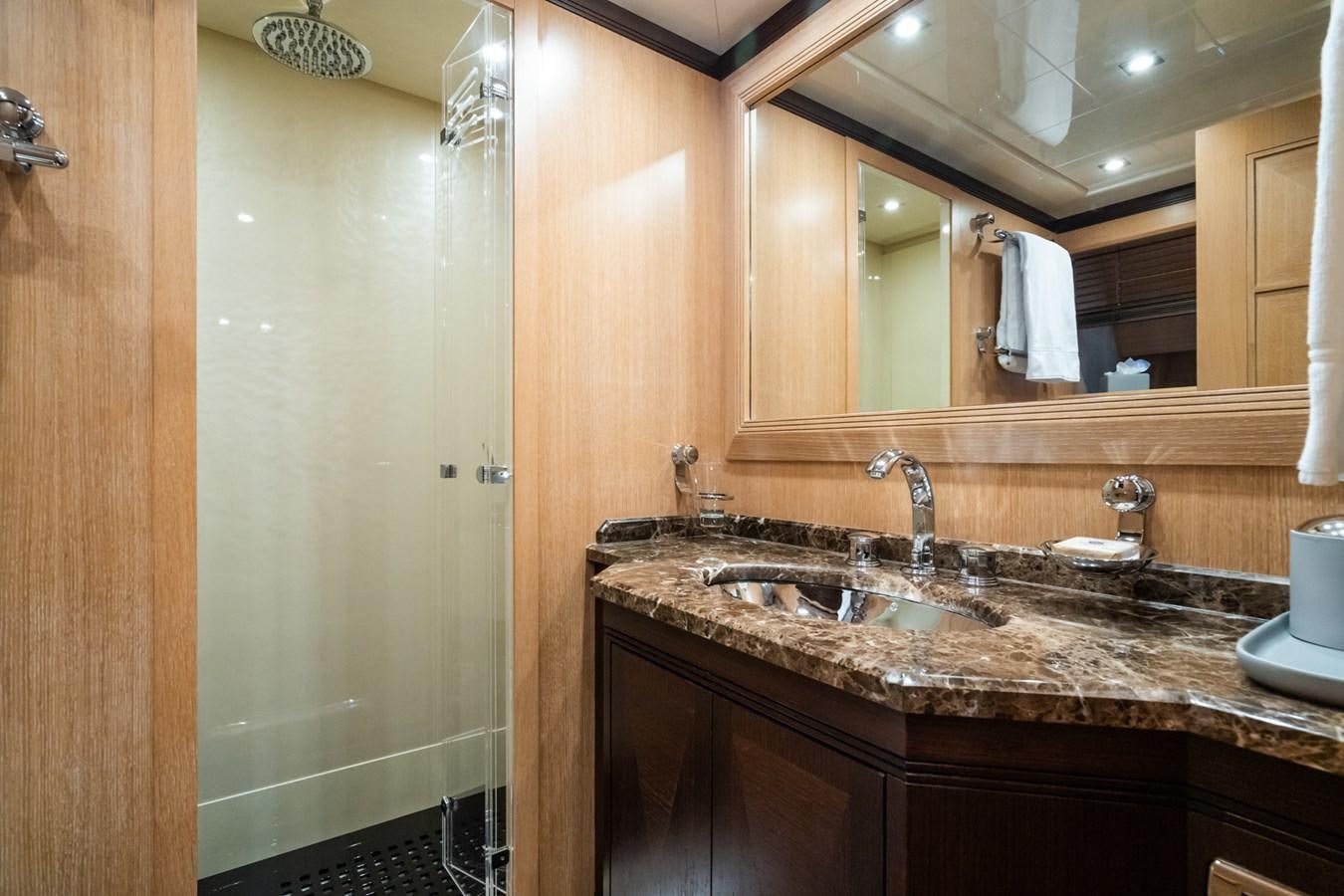 a bathroom with a large mirror aboard TECHNOMARINE Yacht for Sale