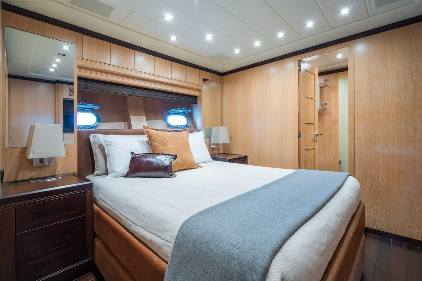 a hotel room with a bed and a desk aboard TECHNOMARINE Yacht for Sale