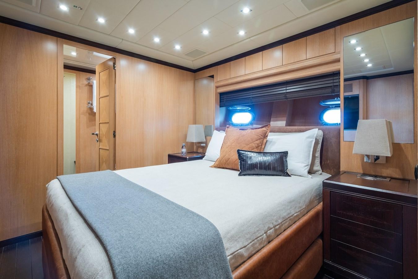 a hotel room with a bed and a tv aboard TECHNOMARINE Yacht for Sale