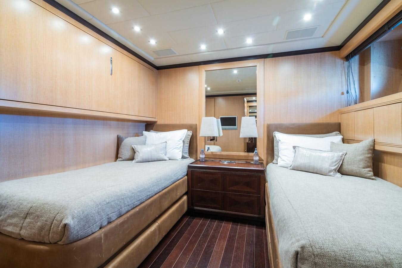 a room with two beds aboard TECHNOMARINE Yacht for Sale