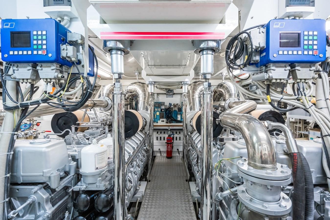 a room with machinery and pipes aboard TECHNOMARINE Yacht for Sale