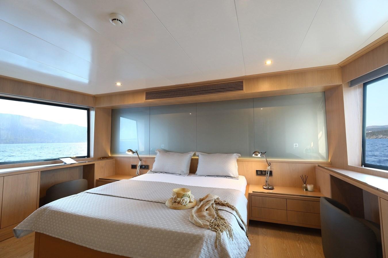 a bedroom with a large window aboard AEGEAN EXPLORER 26M/02 Yacht for Sale