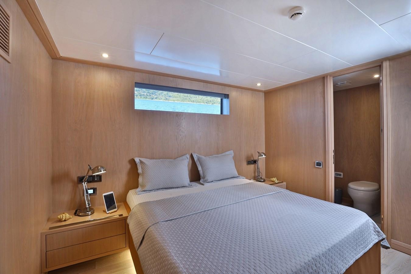 a bed in a room aboard AEGEAN EXPLORER 26M/02 Yacht for Sale