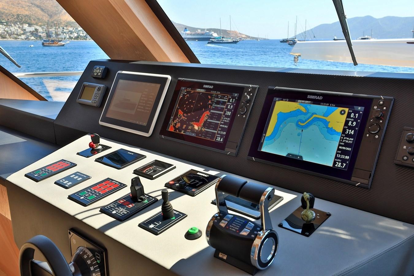 a table with a laptop and a video game on it aboard AEGEAN EXPLORER 26M/02 Yacht for Sale