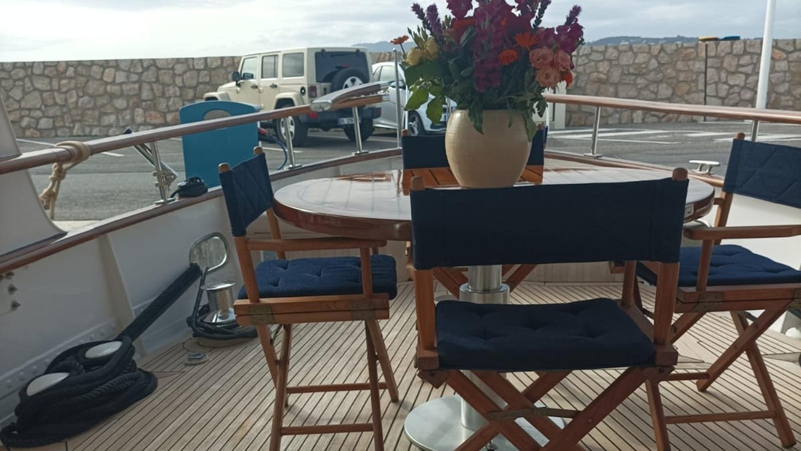 a table with chairs on it aboard SEALORD Yacht for Sale