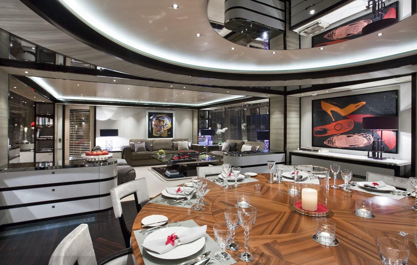 a large living room with a fireplace aboard KAHALANI Yacht for Sale