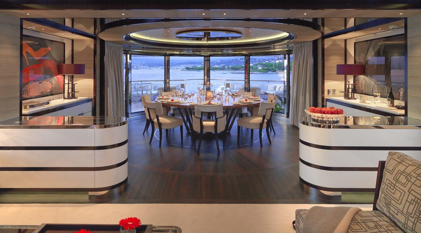 a room with a table and chairs aboard KAHALANI Yacht for Sale