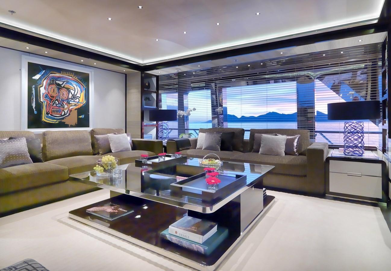a living room with a large window aboard KAHALANI Yacht for Sale